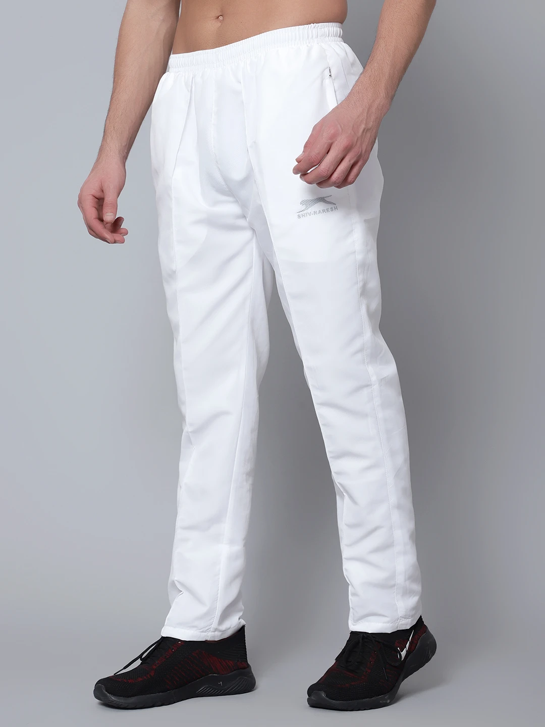 Men's white sports track pants by Shiv Naresh