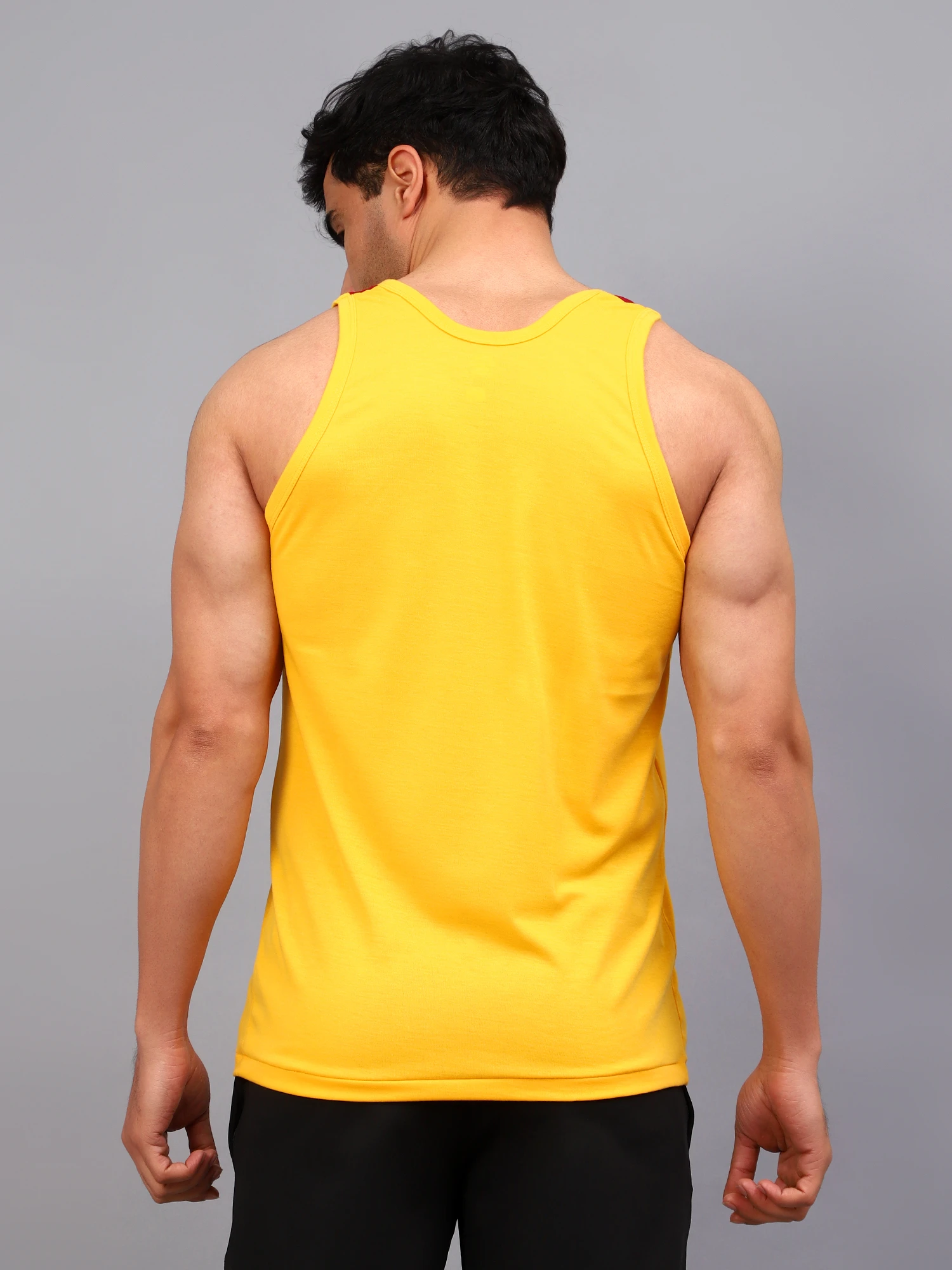 Yellow and maroon colored gym vest for men