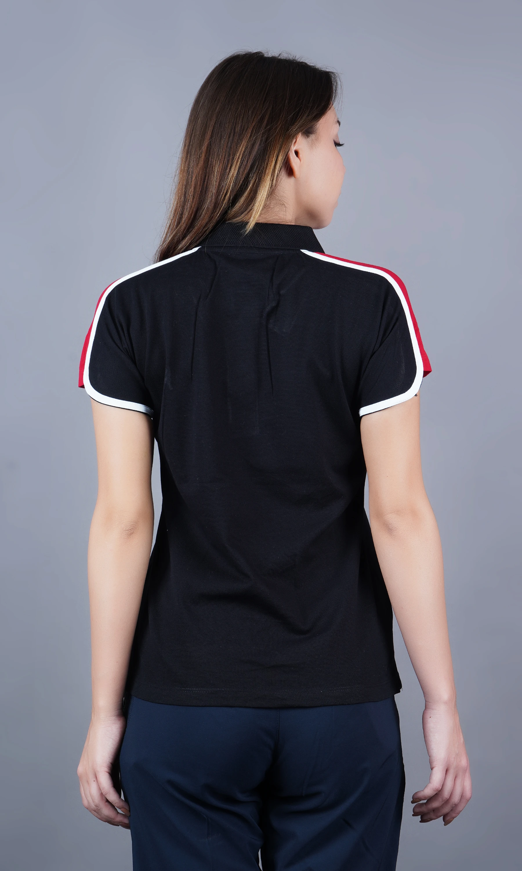 Black solid polo t-shirt for women by Shiv Naresh