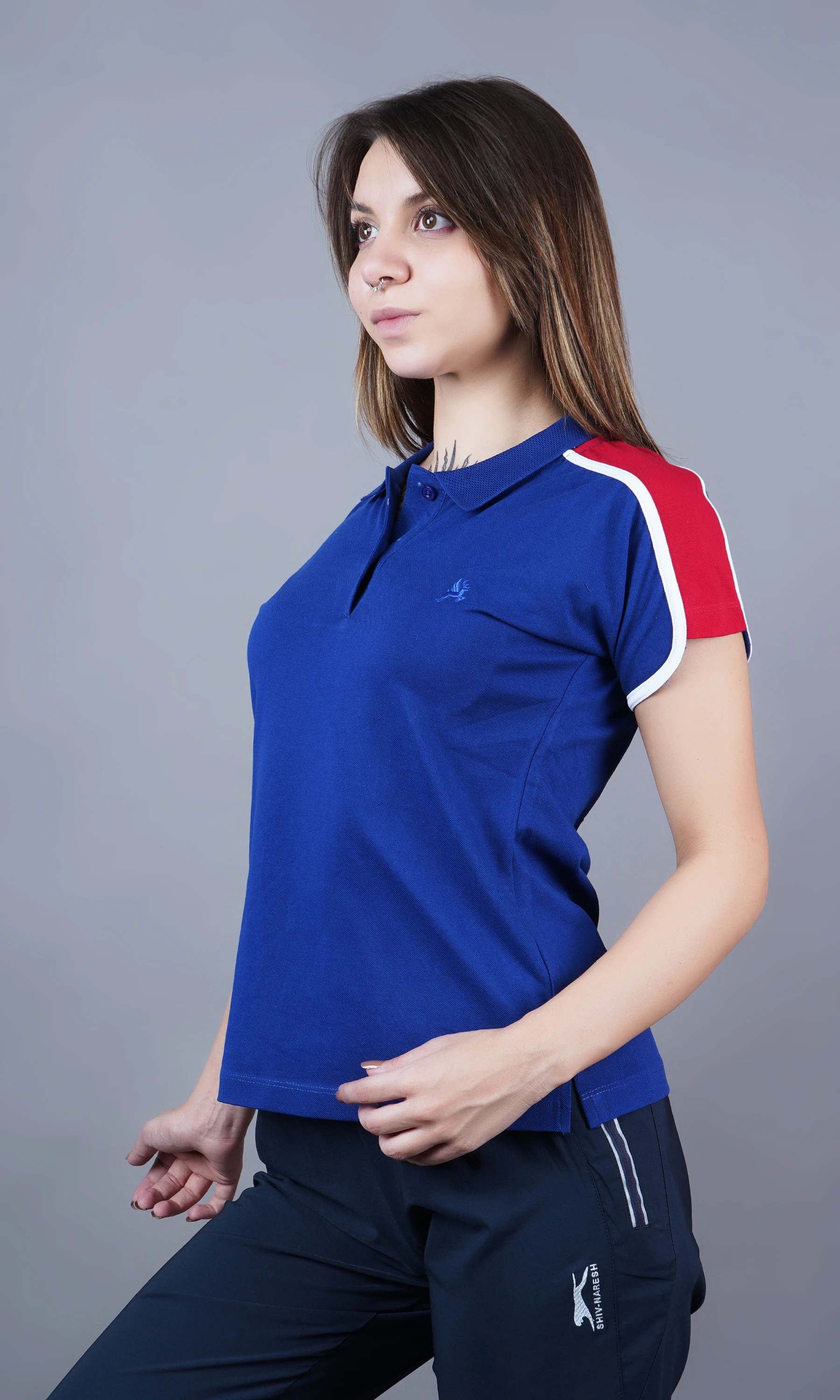 Blue solid polo t-shirt for women by Shiv Naresh